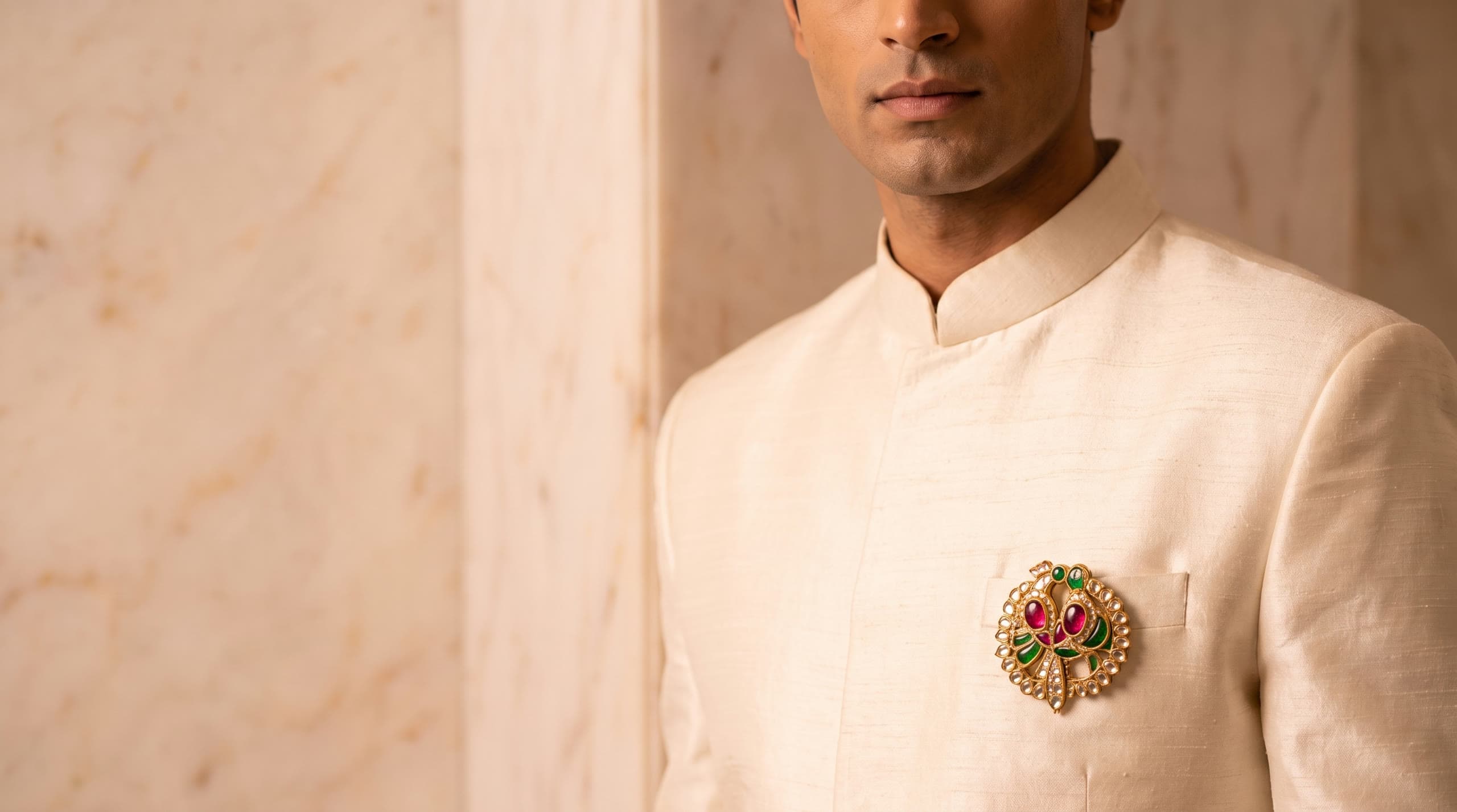 The Golden Zenith kundan bird brooch on an ivory sherwani
